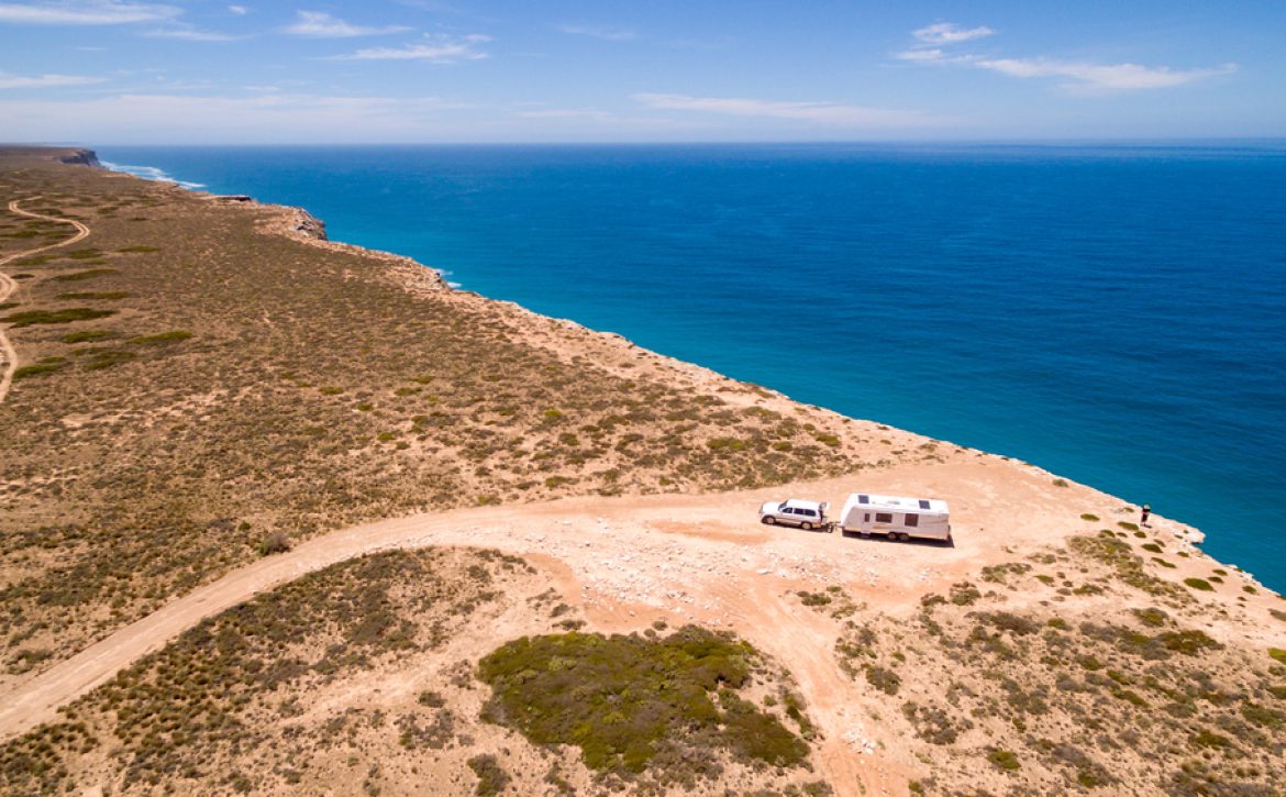 Aerial,View,Of,Four,Wheel,Drive,Vehicle,And,Caravan,Parked